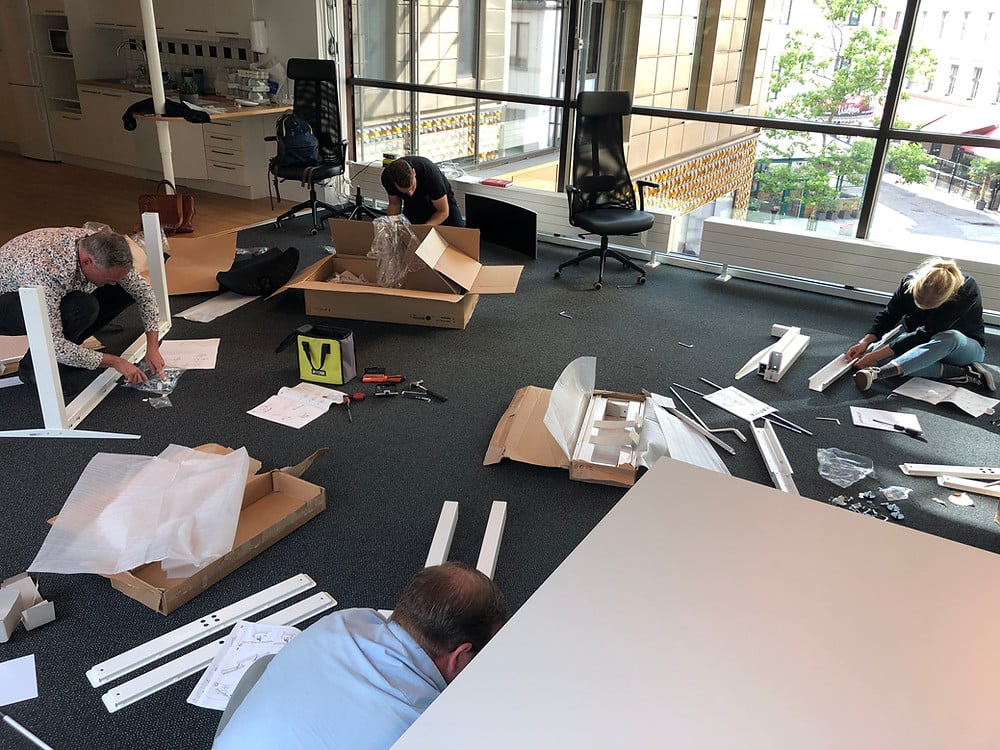 Assembling desks at new office